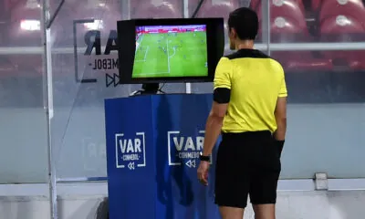 A referee is taking help of VAR