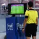 A referee is taking help of VAR