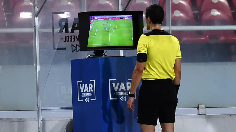 A referee is taking help of VAR