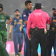 cricketers argue with umpire